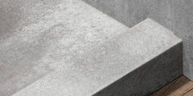 Accessible shower floor with anti-slip texture and low step in height for senior independent living.
