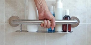 Multi-function shower safety bar and soap shelf installed in shower remodel by Mobility Bath Systems