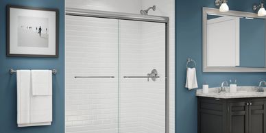 Tub to shower conversion with white acrylic subway tile pattern shower wall surround.