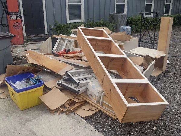 Pile of debris and wood outside an house