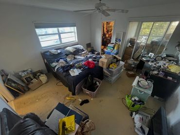 before image of a cluttered bedroom