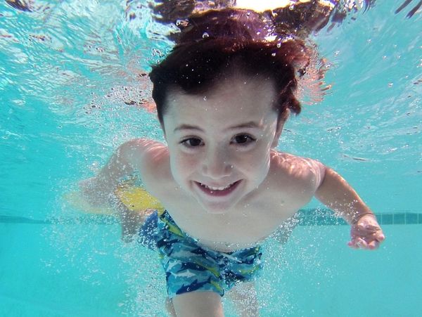 child swimming in heated swimming pool in Preston on holiday park