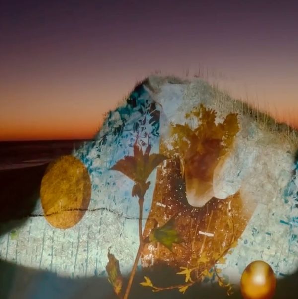 Projection mapping onto a dune by New Media Artist Robin Vuchnich