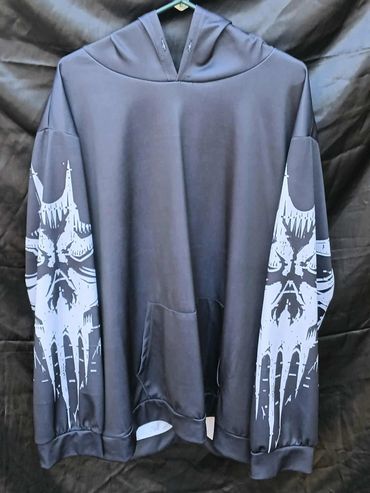 Black hoodie with white skull designs on both sleeves.