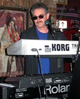 Bruce, a San Diego native, began playing keyboards at the age of 13 on a 500 pound Hammond B3 organ.