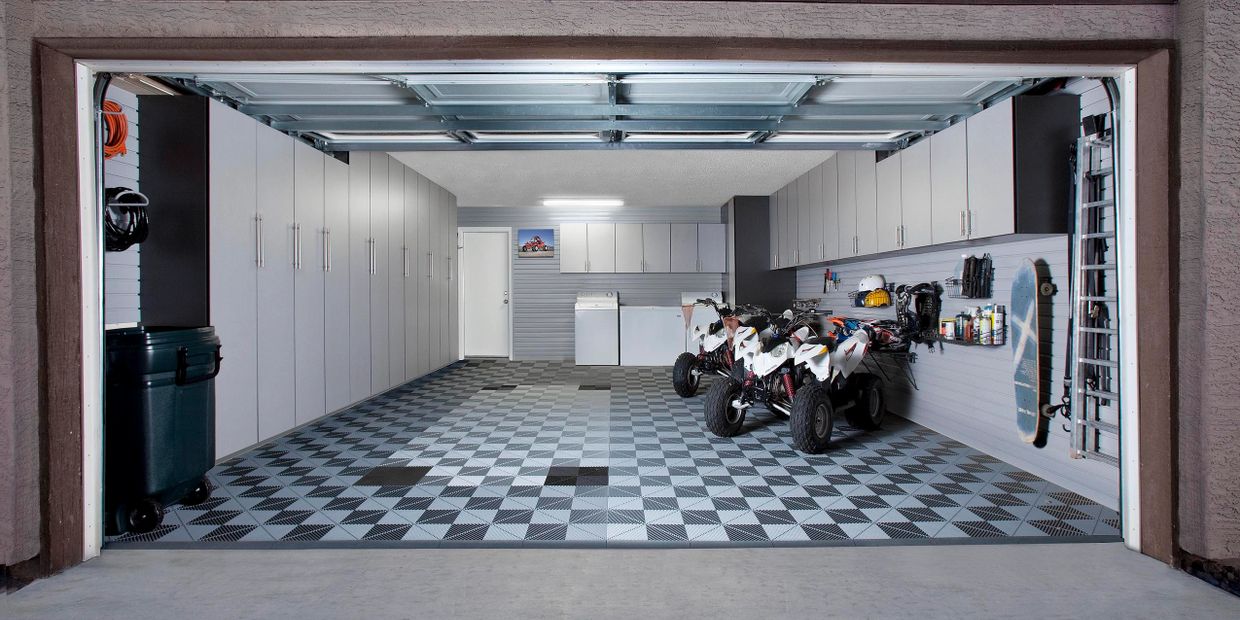 Swisstrax flooring with Silver garage cabinets with slate sides