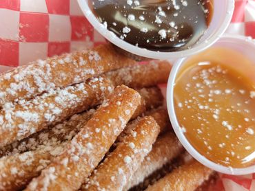 Funnel Cake Fries served with your choice of chocolate or caramel dipping sauce.