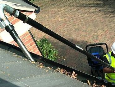 Gutter cleaning, safe and effective clean using a shop-vac to vacuum gutters from the ground