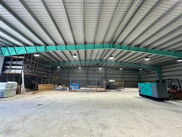 Construction workers assembling structure on site