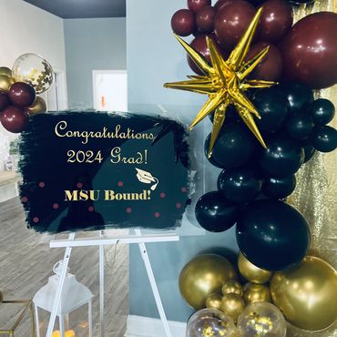 Custom graduation party welcome sign by balloon garland.