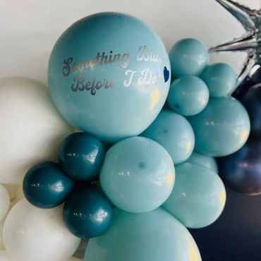Blue personalized balloons for a bridal shower.