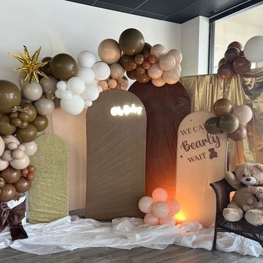 Baby shower decorations in the "We Can Bearly Wait!" theme with brown tones and teddy bears.