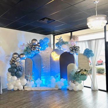Winter Wonderland Themed Baby Shower Backdrop with balloons and custom welcome sign.