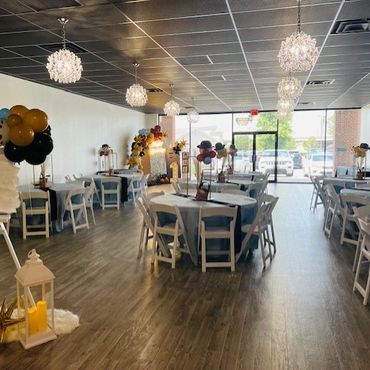 View from the back of the venue showing a decorated event space.