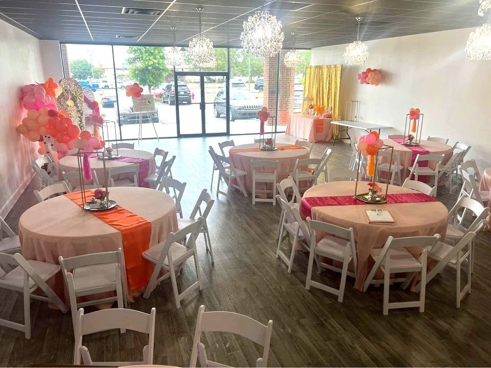 Decorated venue space for a graduation party. Decorated tables, backdrops, and balloons.