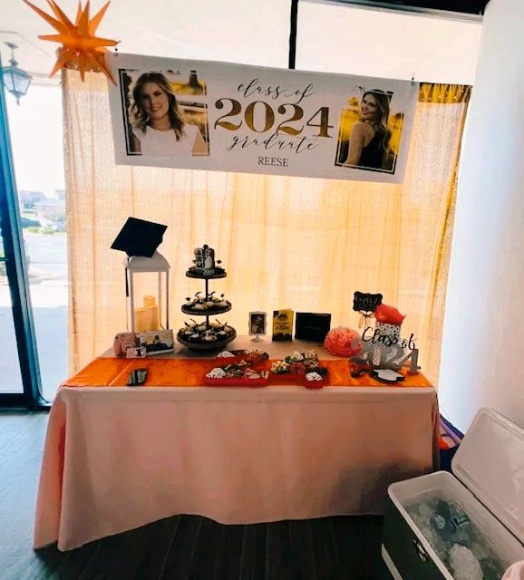 Graduation banner or a grad party at our venue. Decorated dessert table shown.