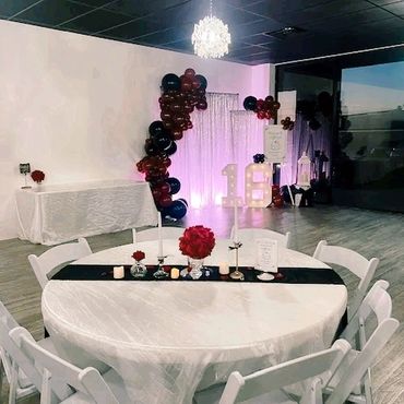 Sweet sixteen backdrop with shimmer silver and balloons.