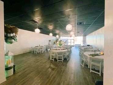 Let the adventure begin baby shower themed decor showing tables and decor.