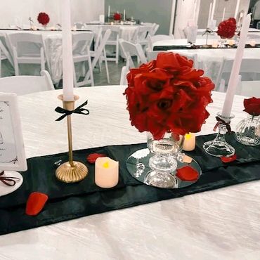 Classy table top decor in rose and black ribbon.