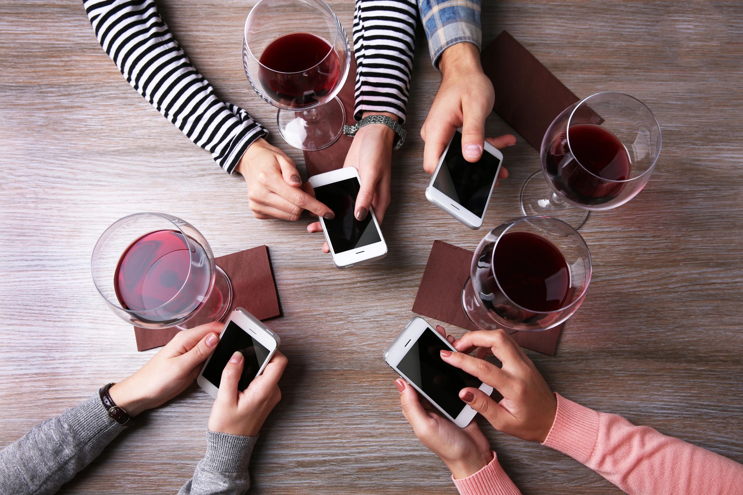 Wine glasses and cell phones