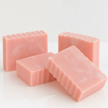 bars of pink soap with a ribbed texture