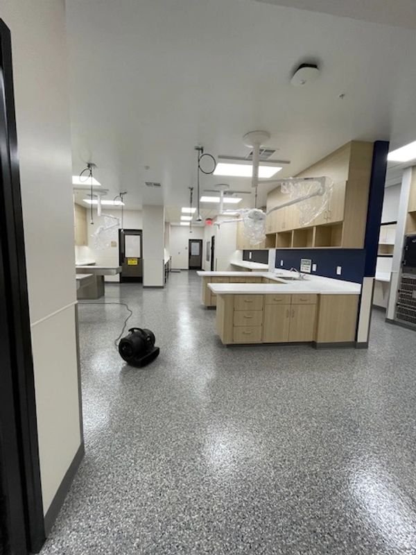 Empty medical or laboratory room with clean counters and equipment.