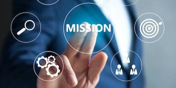 Person in suit pointing at the word 'MISSION' surrounded by business icons.