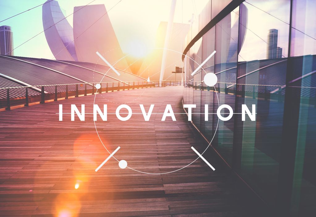 Sunlit modern walkway with the word INNOVATION overlayed, symbolizing progress and creativity.