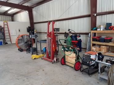 Industrial workshop with tools and equipment neatly arranged.