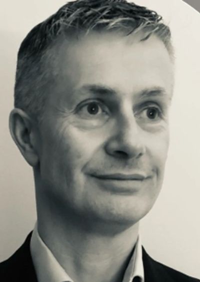 Black and white portrait of a middle-aged man.
