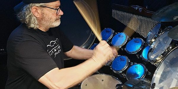 Jerid laying down drum tracks in the studio.