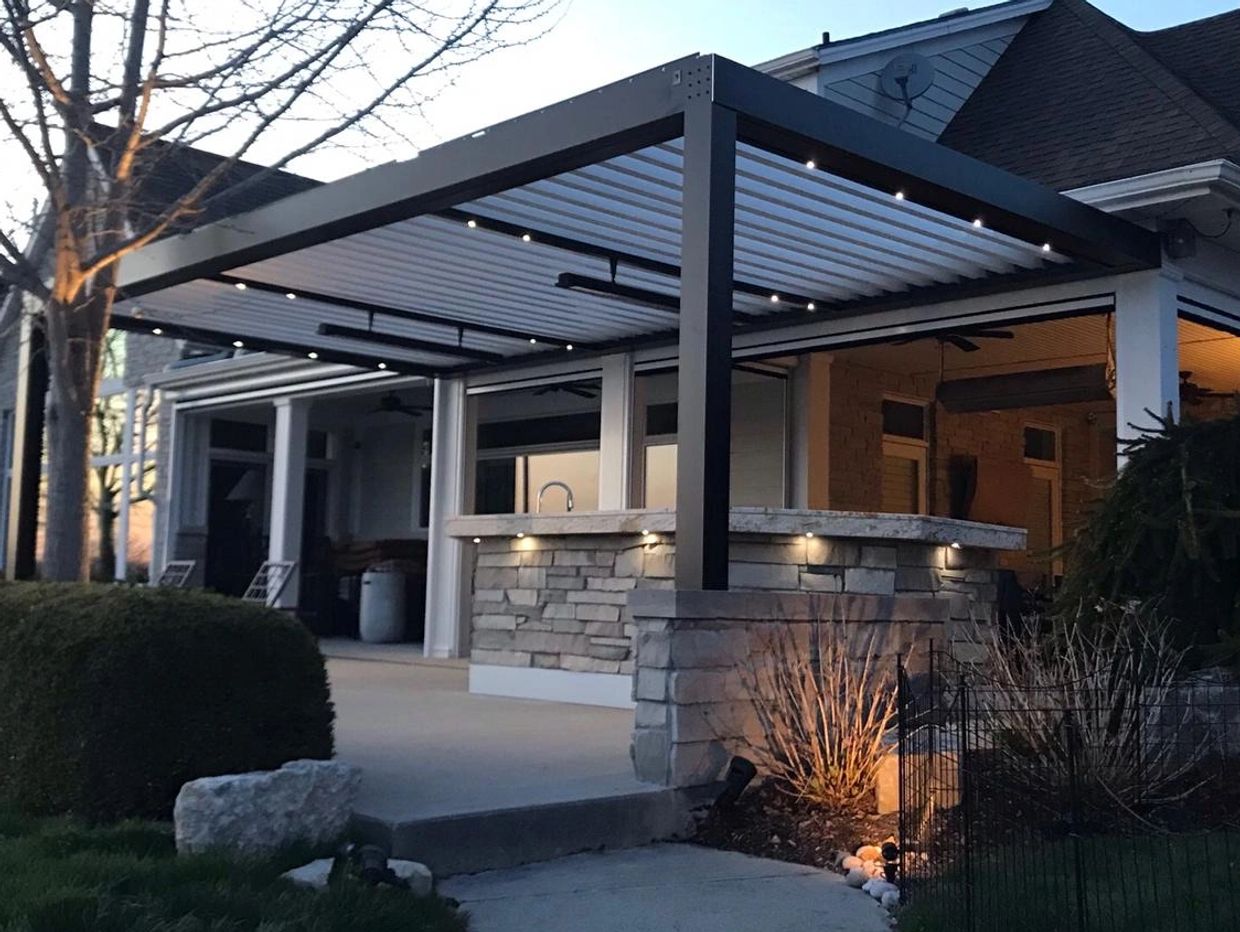 Modern aluminum pergola in Oakville, Ontario with heaters and outdoor landscape lighting