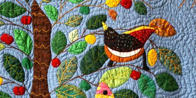 PeaceQuilts, folk art quilts handmade in Haiti.