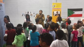 a group of children and an adult having a conversation