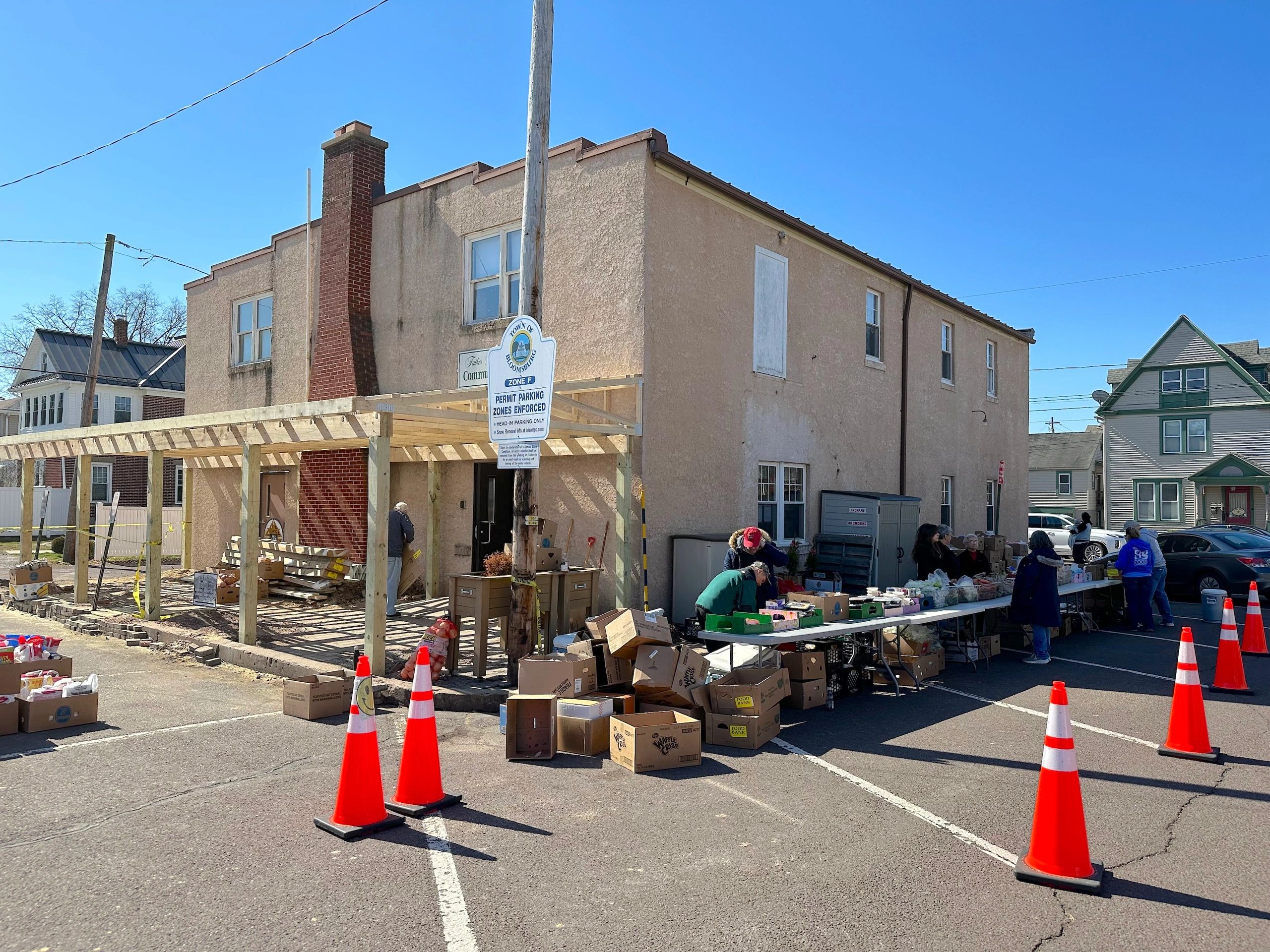 Tuesday. BFC volunteers did not let anything like our new awning get in the way of our weekly distri