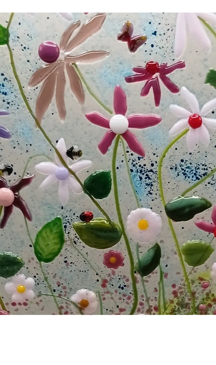Fused glass flowers, daisy, pink blossom and green stems and leaves