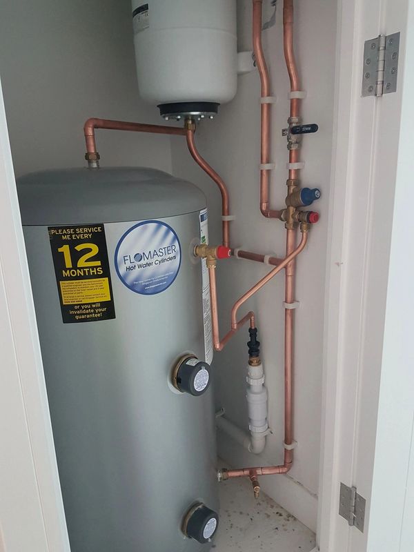 Hot water Unvented storage cylinder installation. Twin immersion on/off peak.
Compact in cupboard.