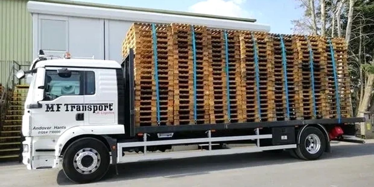 Big car transporting wood