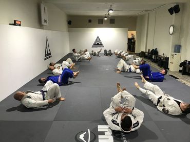 A group of people practicing jiu jitsu