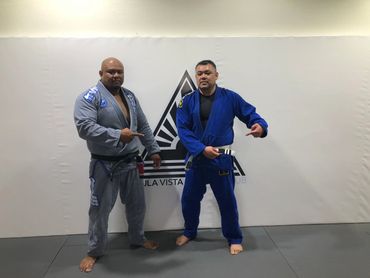 Two men in a jiu jitsu class
