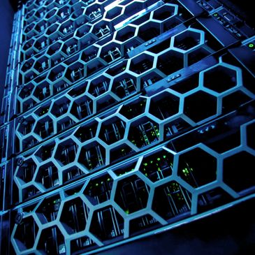 Close-up of a server rack with hexagonal grille design and glowing indicators.