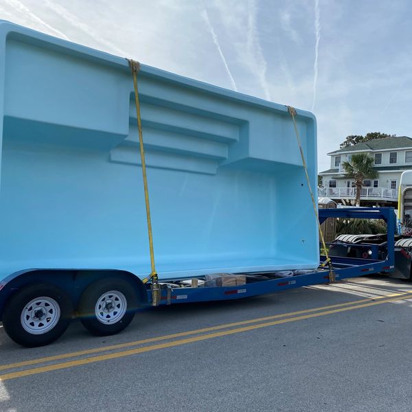 Sun Drenched Pools installation of a San Juan Fiberglass Pool sully blue broadway model