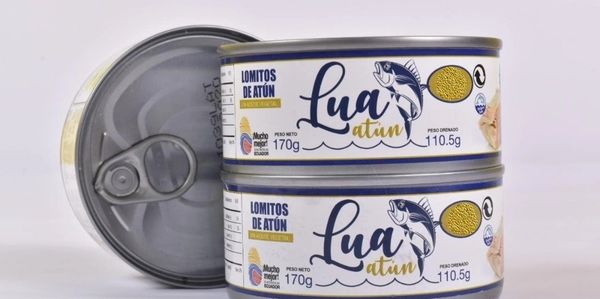 Two stacked cans of Lua brand tuna with an opened can beside them.