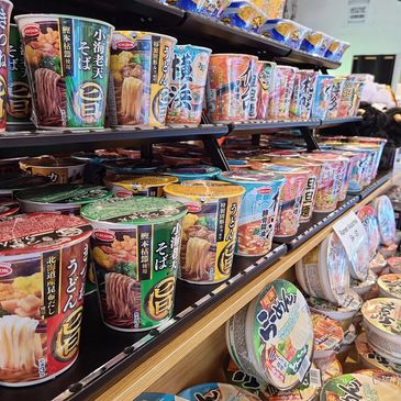 Shelves filled with Japanese instant noodle cups.