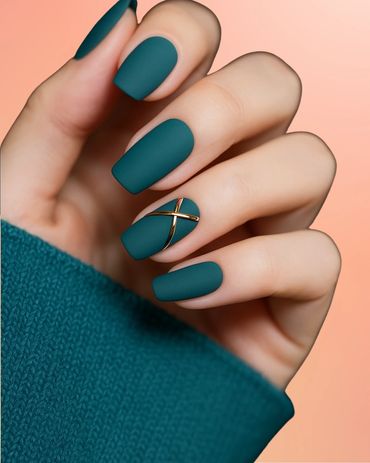 Matte teal nails with a gold cross accent on one nail.