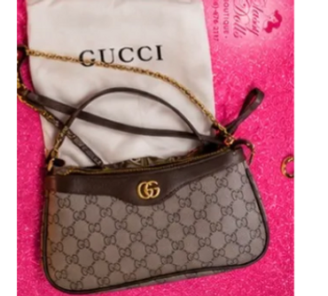 LEATHER GUCCI CROSSBODY. SAYS GUCCI ON INSIDE/ZIPPER. PAPERWORK AND BOX INCLUDED. $85.00