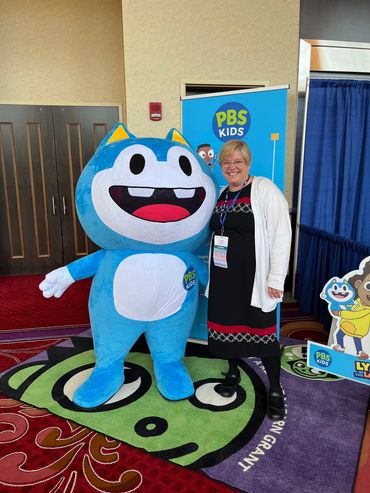 Tricia Crissman at PBS Kids booth at the NYAEYC conference