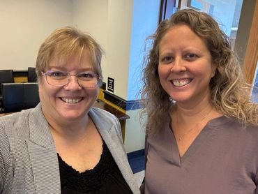 Tricia Crissman with a center director after a training session