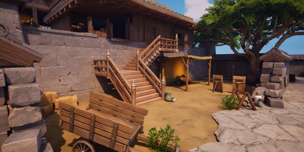 Medieval courtyard with wooden cart and stairs.