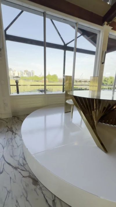 Round white stage against the NYC skyline